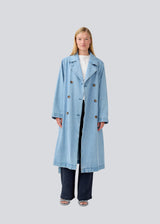 Oversized double-breasted trench coat in denim. MadelineMD denim jacket has dropped shoulders, long wide sleeves and a tieband at the waist.