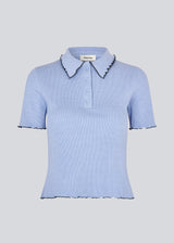 Fitted polo in jersey. MagdaloneMD polo has short sleeves and babylock edges.