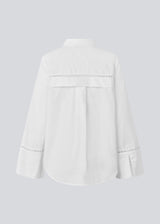 Oversize shirt with broderie anglaise details. MallenMD shirt has long wide sleeves with slits, shirtcollar and a button closure in front.