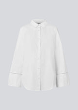 Oversize shirt with broderie anglaise details. MallenMD shirt has long wide sleeves with slits, shirtcollar and a button closure in front.