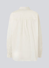 Classic shirt in white with an oversized fit. MallinMD shirt has a collar and a hidden button closure. 