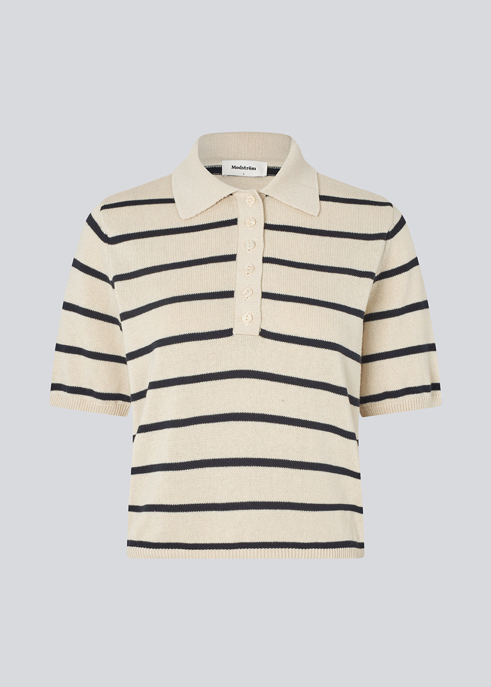 Soft knitted polo in plain jersey knit. MalvaMD stripe polo has a collar and a buttonclosure in front and short sleeves.