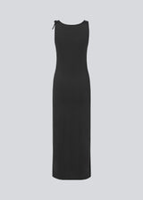 Long fitted dress in black in an elastic material. MaverickMD long dress is sleeveless and has a bowdetail on the shoulder.