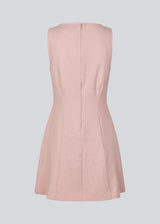 Fitted dress without sleeves. MaxwellMD tank dress has a round neck and an invisible zipper in the back.