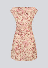 Fitted dress with asymmetrical sleeves. MeliaMD print dress has pleats and an invisible zipper on the side.