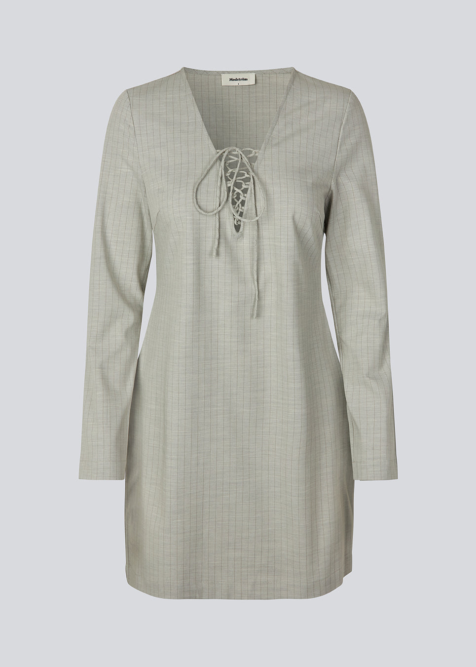Short fitted dress with a v-neck with a lace-up detail. MickyMD dress has long sleeves and a zipper in the side.