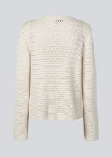 Crochet top in organic cotton. MieMD top has detailed trimmings and long wide sleeves.