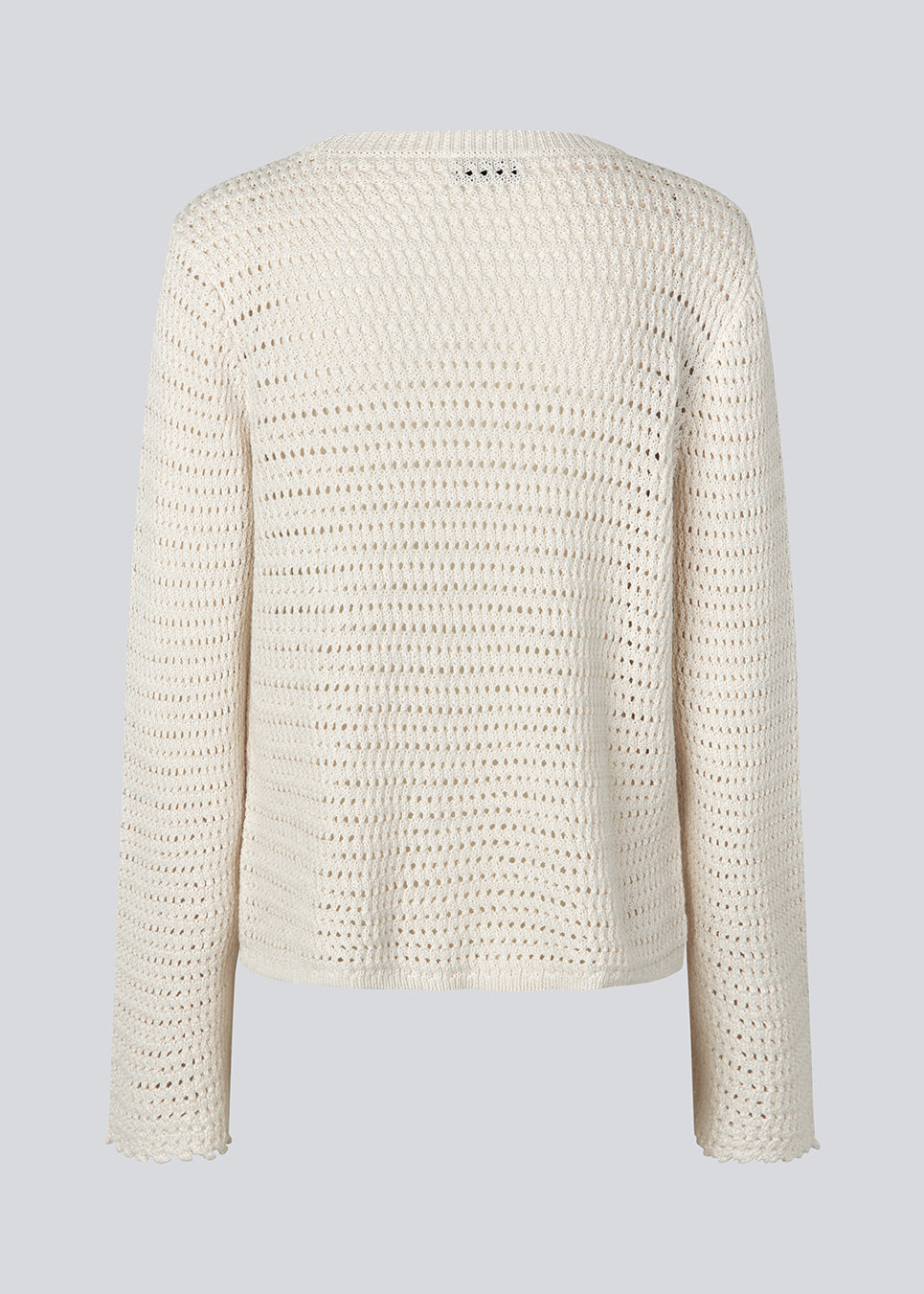 Crochet top in organic cotton. MieMD top has detailed trimmings and long wide sleeves.