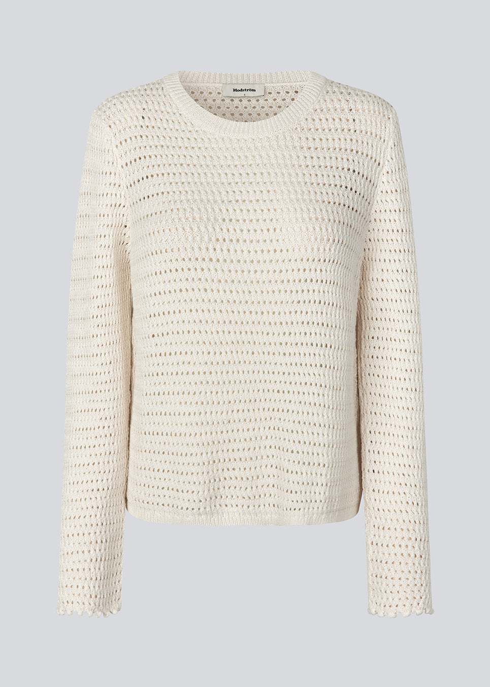Crochet top in organic cotton. MieMD top has detailed trimmings and long wide sleeves.
