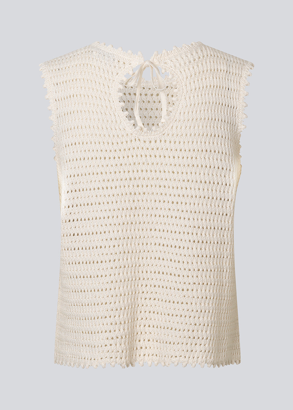 Crochet top without sleeves in organic cotton. MieMD top has detailed trimmings and a deep v-neckline in the back with a tieband closure