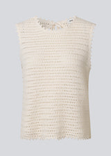 Crochet top without sleeves in organic cotton. MieMD top has detailed trimmings and a deep v-neckline in the back with a tieband closure