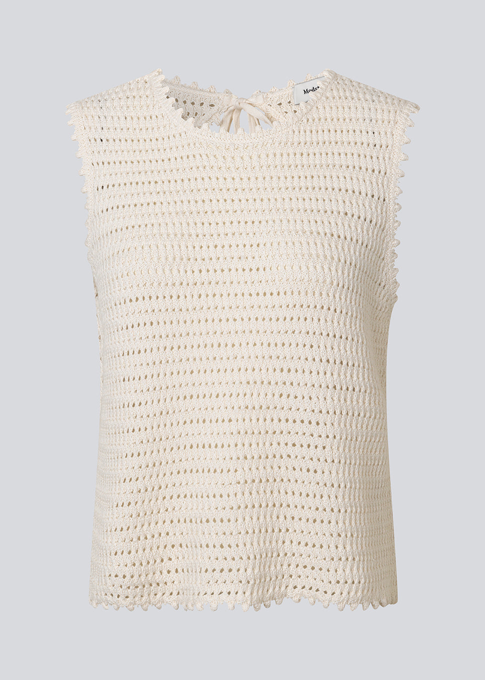 Crochet top without sleeves in organic cotton. MieMD top has detailed trimmings and a deep v-neckline in the back with a tieband closure