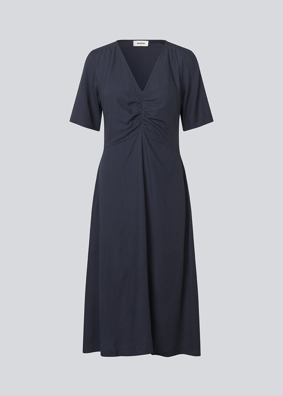 Long dress with short sleeves and a v-neck. MiguelMD SS dress has smock details and an invisible zipper on the side.
