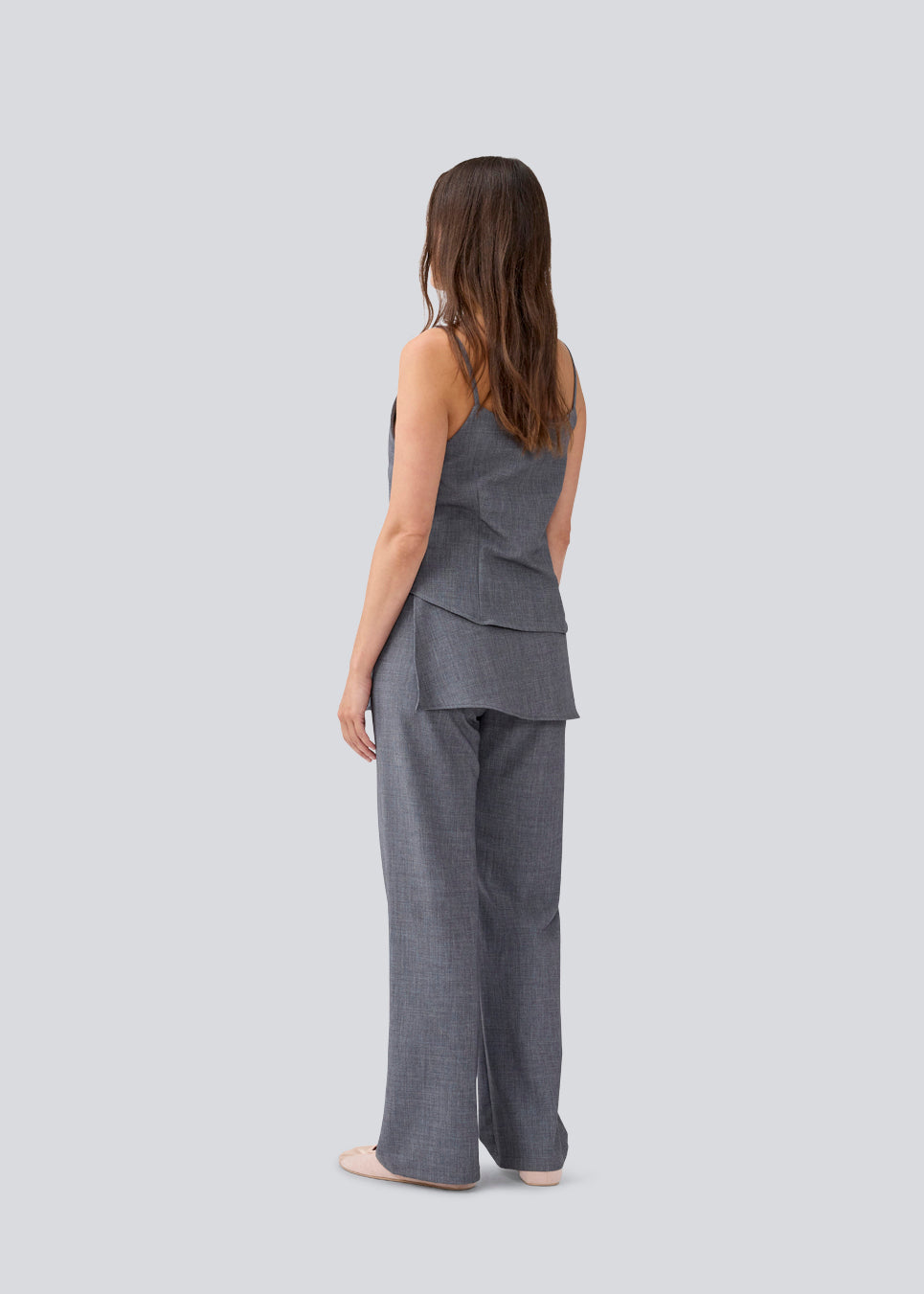 Sleeveles top with thin straps and a button closure. MikkelineMD top has two pocket and a hidden button closure in front.