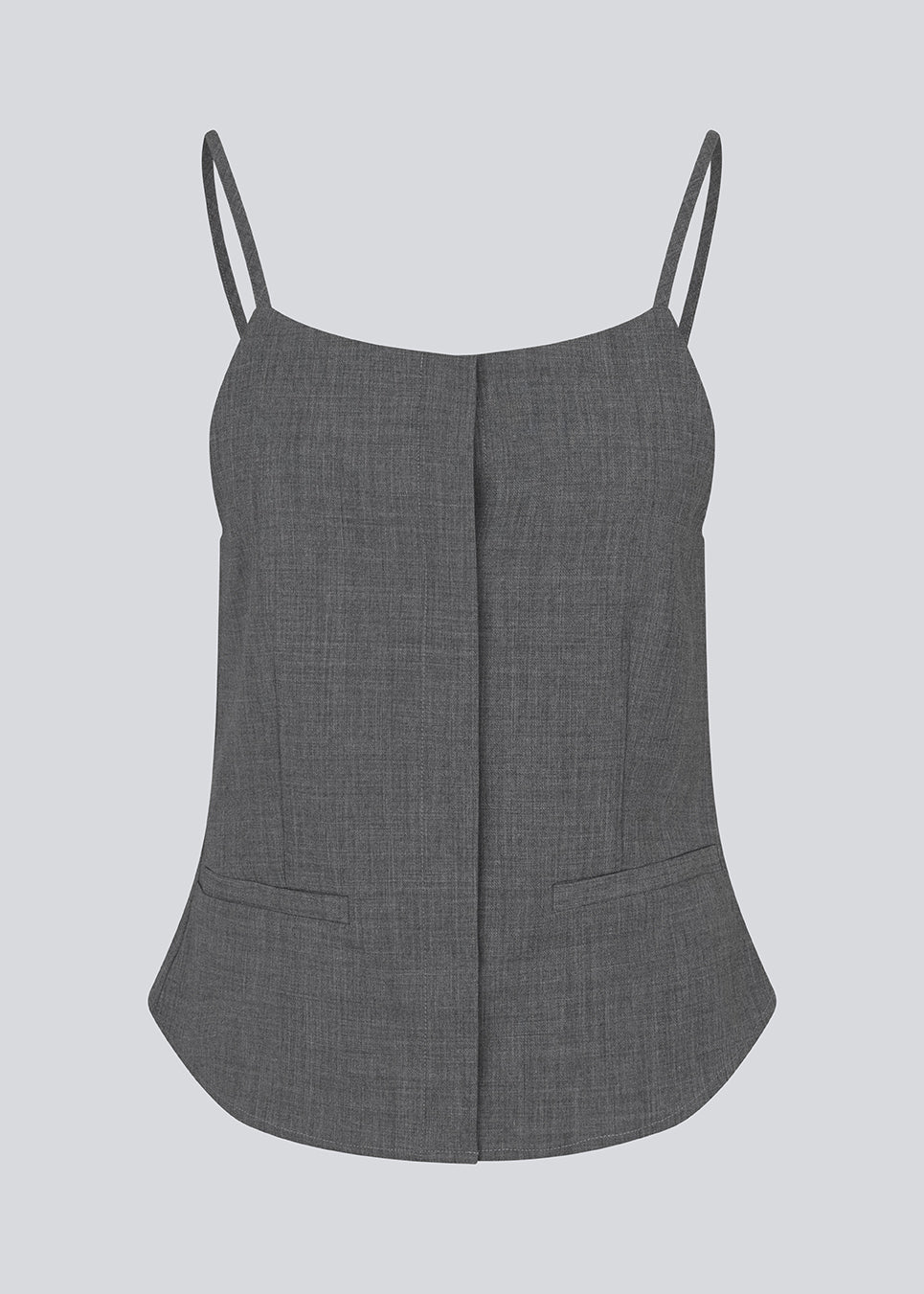 Sleeveles top with thin straps and a button closure. MikkelineMD top has two pocket and a hidden button closure in front.
