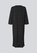 Maxi dress in broderie anglaise. MisoMD dress has a loose fit, v-neck and a tieband at the waist.