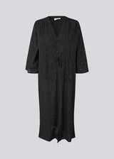 Maxi dress in broderie anglaise. MisoMD dress has a loose fit, v-neck and a tieband at the waist.