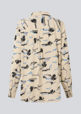 Classic shirt with a loose fit. MistMD print shirt has long sleeves, collar and a button closure in front.