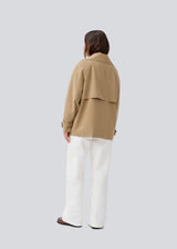 Loose double breasted jacket with button closure. MorganMD jacket has a high neck and wide sleeves with adjustable straps.