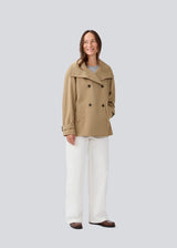 Loose double breasted jacket with button closure. MorganMD jacket has a high neck and wide sleeves with adjustable straps.