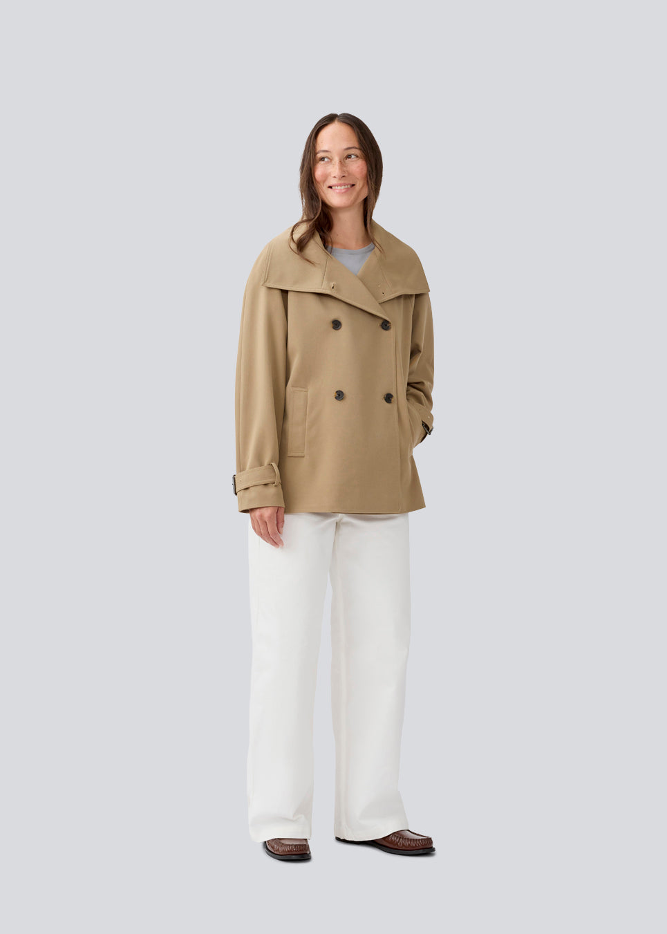 Loose double breasted jacket with button closure. MorganMD jacket has a high neck and wide sleeves with adjustable straps.