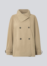 Loose double breasted jacket with button closure. MorganMD jacket has a high neck and wide sleeves with adjustable straps.