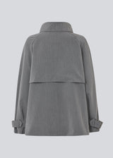 Loose double breasted jacket with button closure. MorganMD jacket has a high neck and wide sleeves with adjustable straps.