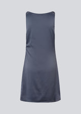 Short dress i dark blue with a waterfall detail in front. MylaMD dress is made of satin and has an invisible zipper on the side.