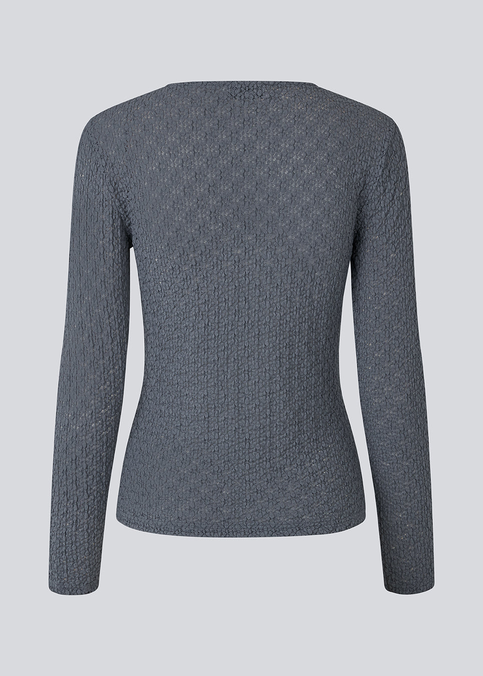 Fitted top in a structured and elastic material. MynteMD LS top has long sleeves and is slightly see-trough. 