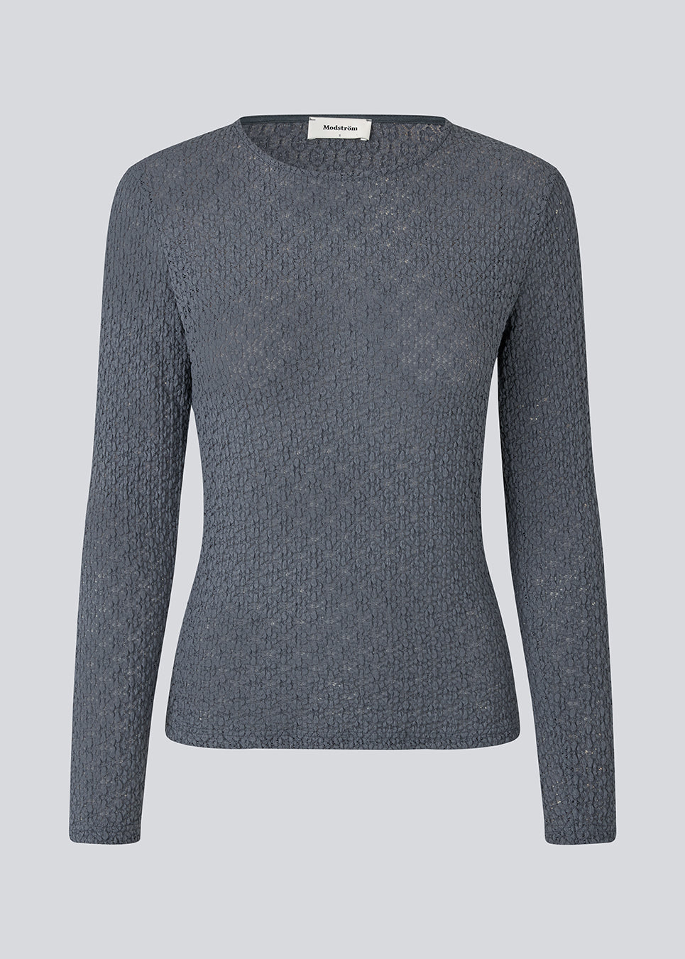 Fitted top in a structured and elastic material. MynteMD LS top has long sleeves and is slightly see-trough. 