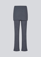 Long flared pants with a skirt. MynteMD pants is made in an elastic and structured material and has an elastic in the waist.