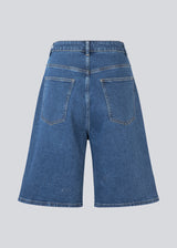 Long shorts with wide legs in cotton denim. NadjaMD solid shorts have a zipper fly, a high waist, and front and back pockets.