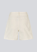 White denim shorts with wide legs in cotton denim. Naomamd solid shorts have a high waist, front and back pockets, and a tie band at the waist.