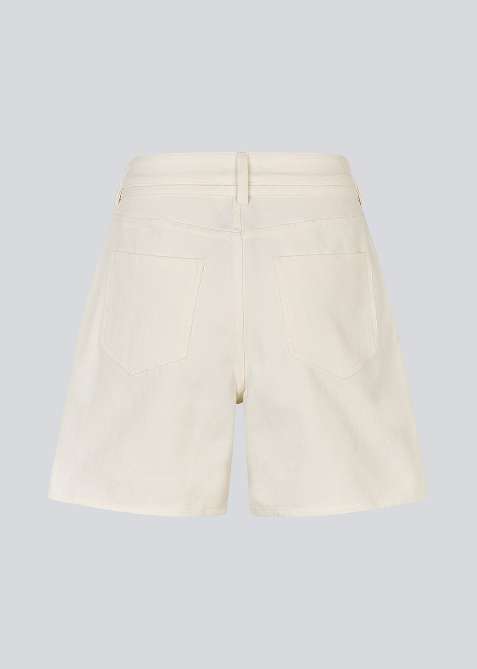 White denim shorts with wide legs in cotton denim. Naomamd solid shorts have a high waist, front and back pockets, and a tie band at the waist.