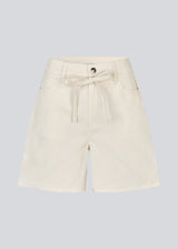 White denim shorts with wide legs in cotton denim. Naomamd solid shorts have a high waist, front and back pockets, and a tie band at the waist.