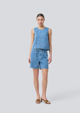 Denim shorts with wide legs in cotton denim. Naomamd solid shorts have a high waist, front and back pockets and a tie band at the waist.