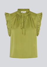 Sleeveless top in green with frill details and a loose fit. NarcissaMD top has frills at the sleeves and neckline, and an opening in front with a tieband closure.
