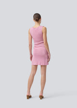 Short pink fitted dress in shimmery knit. NavalMD dress is sleeveless and has a round neckline.