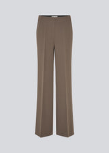 Classic pants with pressfolds and straight legs. Nelli pants are closes by an hidden zipper at the side with an elastic waistband for a more comfortable fit. 