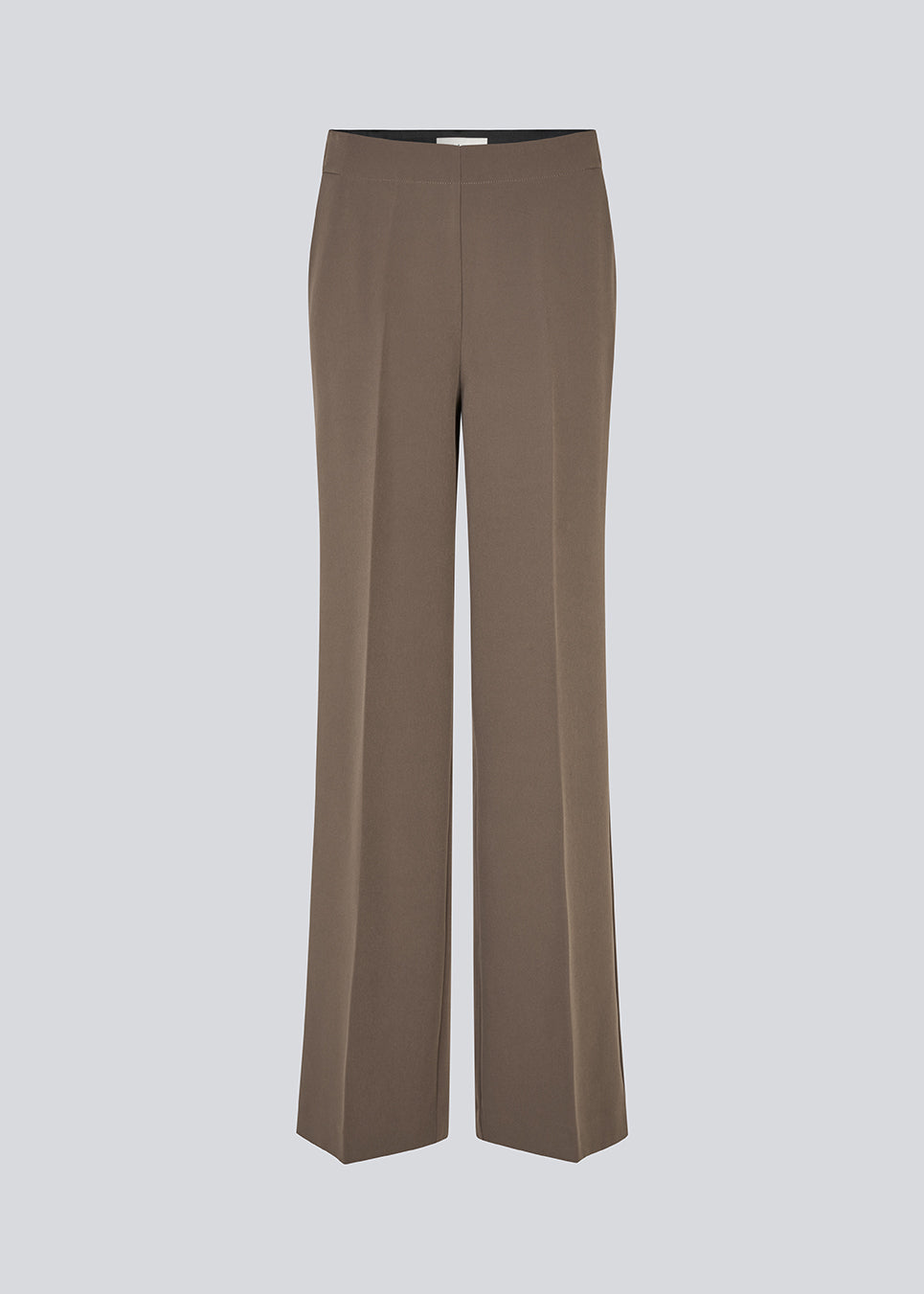 Classic pants with pressfolds and straight legs. Nelli pants are closes by an hidden zipper at the side with an elastic waistband for a more comfortable fit. 