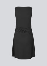 Short sleeveless dress in ribbed jersey. NemiMD dress has a round neckline and elastic gatherings in the sideseam.