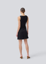 Short sleeveless dress in ribbed jersey. NemiMD dress has a round neckline and elastic gatherings in the sideseam.