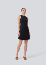 Short sleeveless dress in ribbed jersey. NemiMD dress has a round neckline and elastic gatherings in the sideseam.