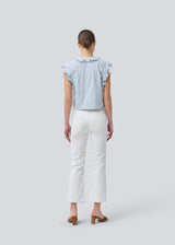 Sleeveless top with frill details and a button closure in front with stripes. NikkoMD top is slightly cropped and has a v-neck.
