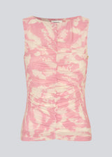 Sleeveless top in an elastic material. NimramD top has a round neck and gatherings in front.