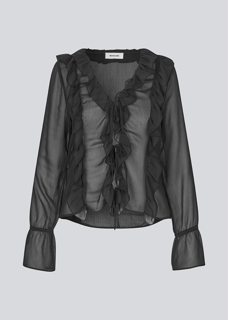 Long-sleeved top in black with a loose fit and frill details. NorrisMD top has a v-neck and wide sleeves with tie bands. The top is slightly seethrough. 