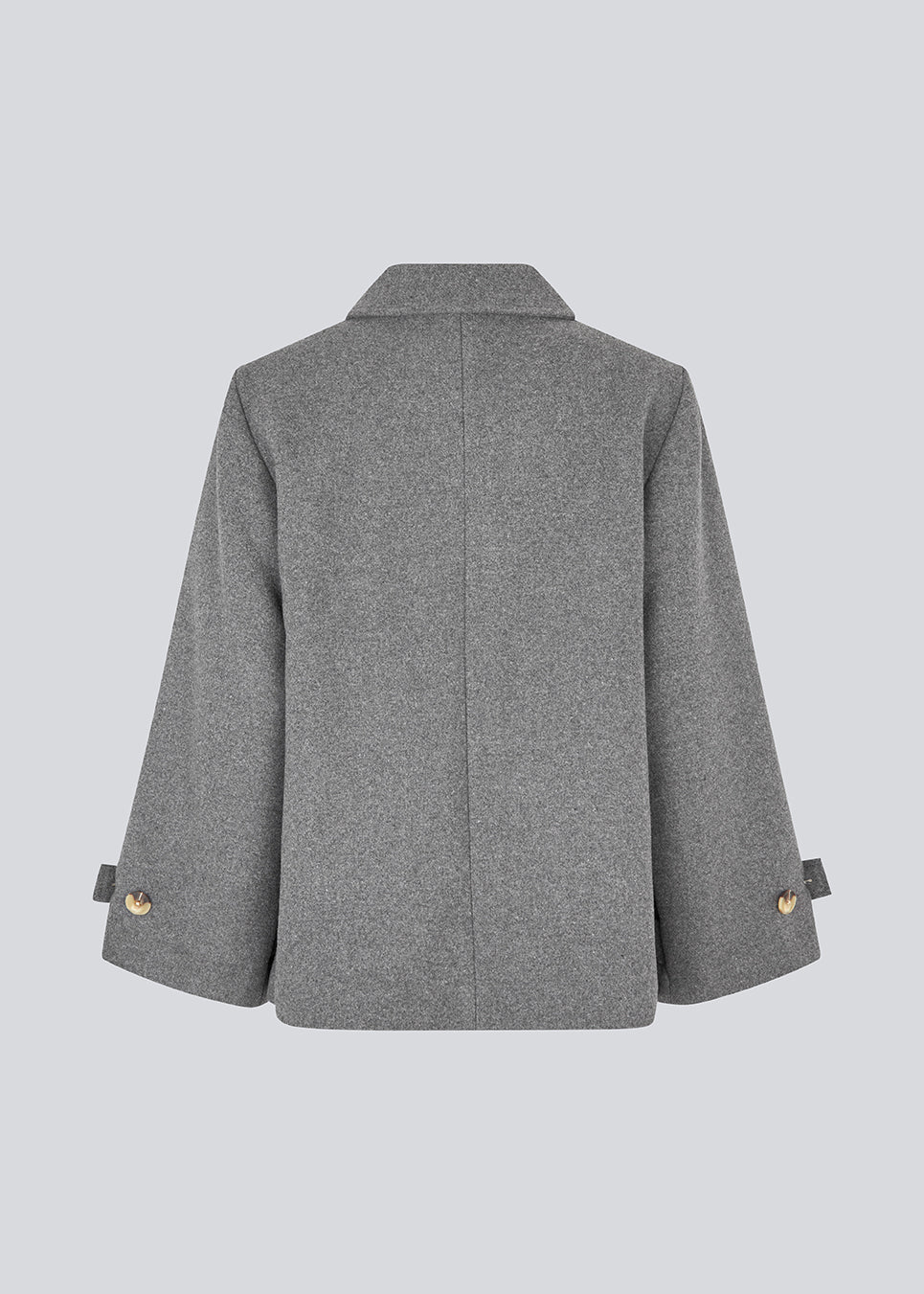 Classic short jacket in a wool mix. Ofiamd jacket has a relaxed fit, hidden button closure and collar. The model is 175 cm and wears a size s/36.
