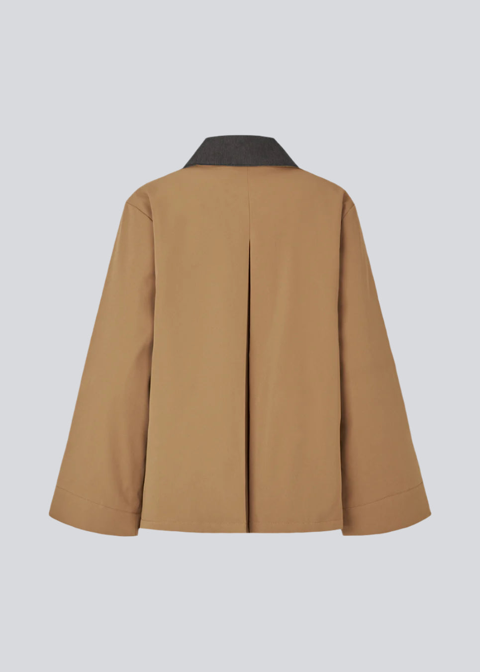 Lose jacket in beige with a contrast corduroy collar and hidden press buttons. Orkidemd jacket has an inverted pleat on the back. 