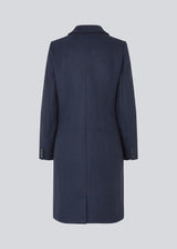 Beautiful, long wool coat in navy. Pamela coat is closed by 3 big buttons at front and is waisted, which gives a feminine look. Because of the high content of wool you will be able to keep warm all through fall and the mild winters.