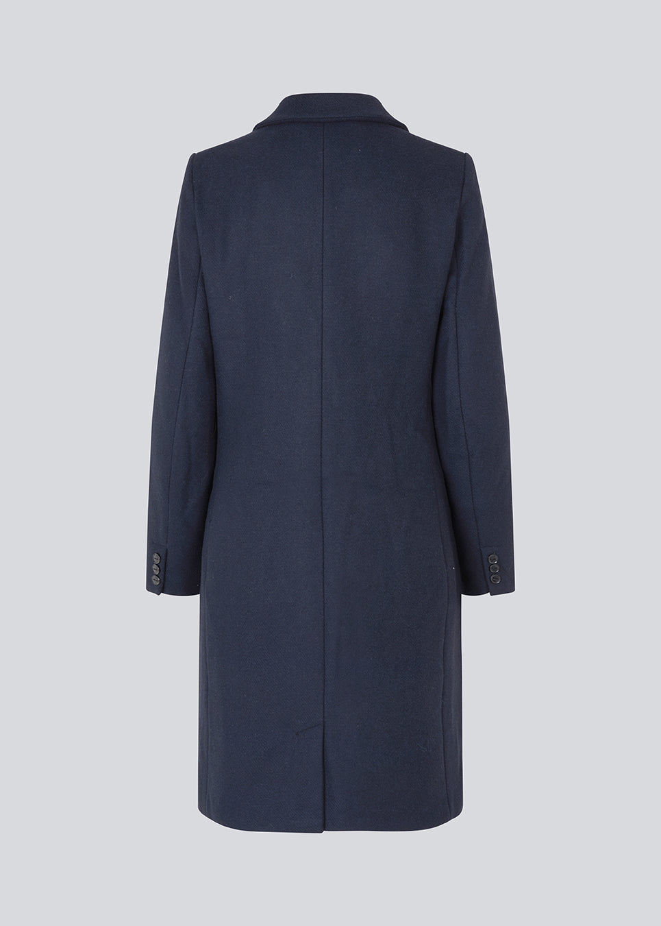 Beautiful, long wool coat in navy. Pamela coat is closed by 3 big buttons at front and is waisted, which gives a feminine look. Because of the high content of wool you will be able to keep warm all through fall and the mild winters.